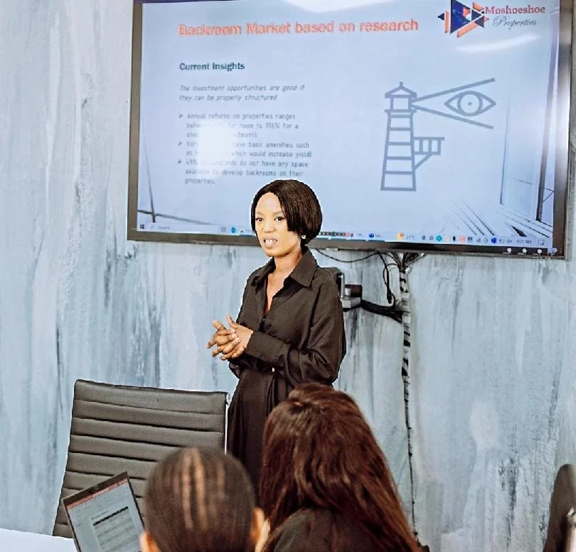 Dr Nthabiseng presenting backroom market research to township landlords